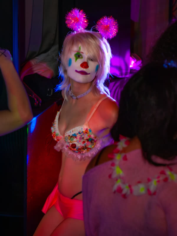 Guest wearing pink ears and a pink outfit at Dress to Impress, photographed by Jay Snaps