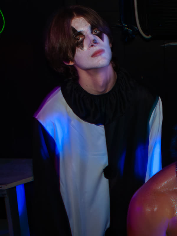Guest wearing black and white face makeup at Dress to Impress, photographed by Jay Snaps
