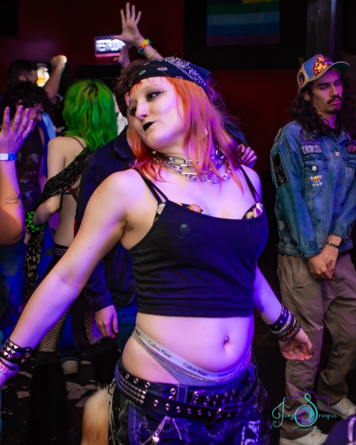 Guest posing at a Chronically Online party